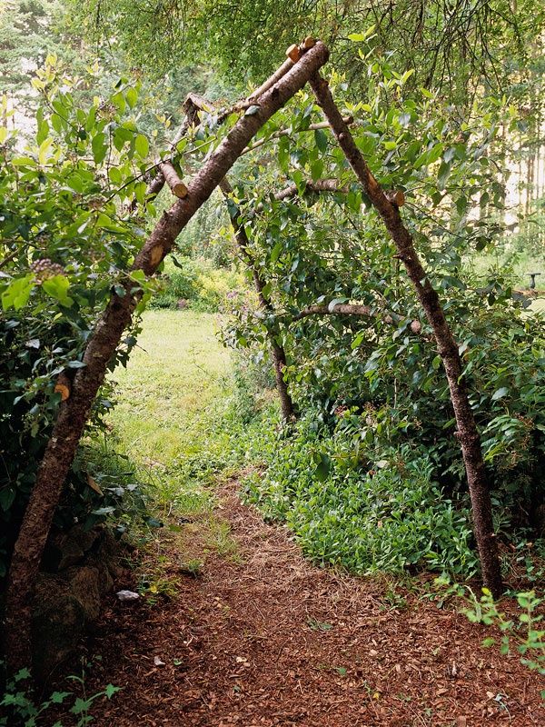 rustic garden arbor out of sticks.